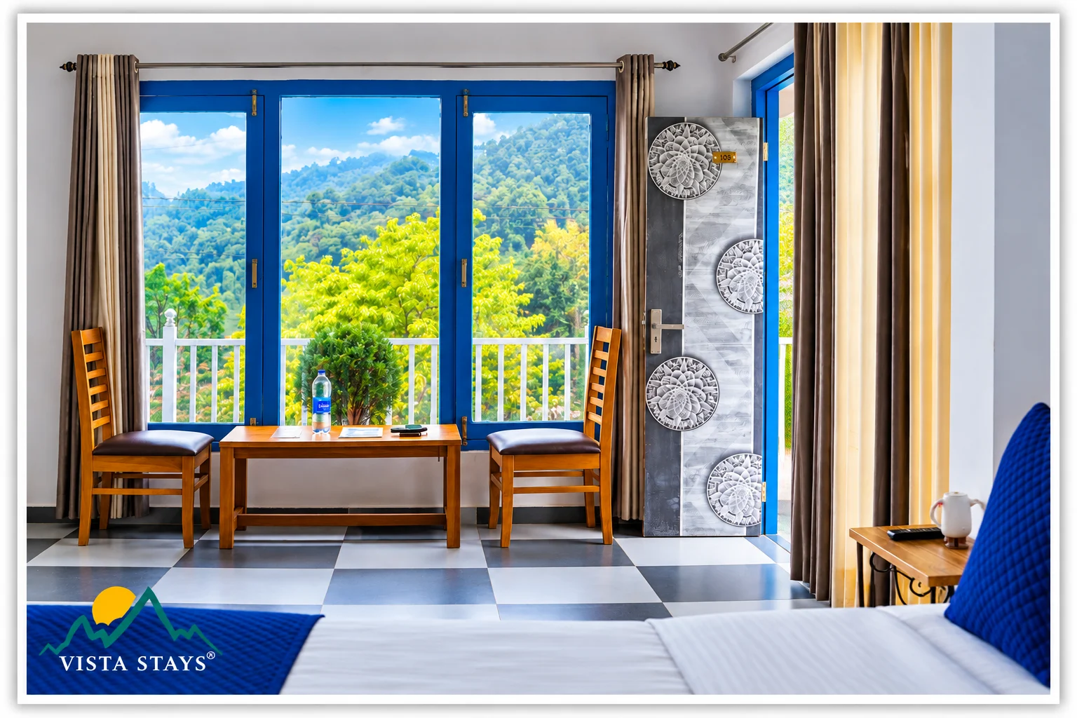 A bedroom seating area beside blue windows at Hidden Lake by Vista Stays.