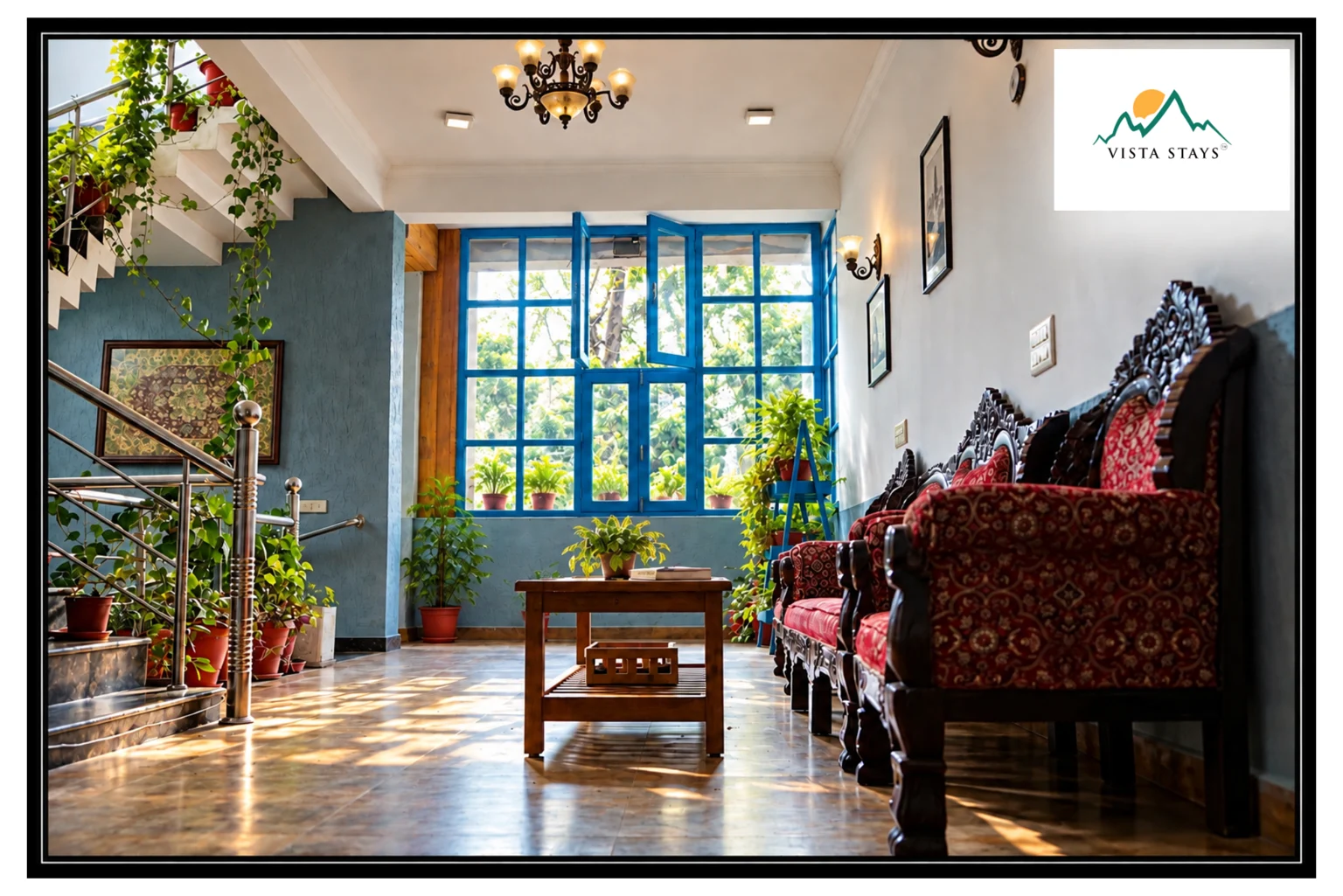 A sitting area beside blue-framed windows at Hotel Vista.